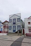 Facade of building under construction covered with banner