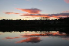 river near the city at sunset