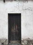 Contrast of the Old Wood Door on white wall