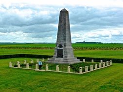 war memorial among green field