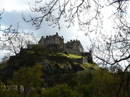 distant view of a castle on a hill in scotland