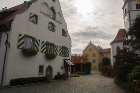 facades of old houses on a city street