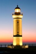 lighthouse on the coast at dawn
