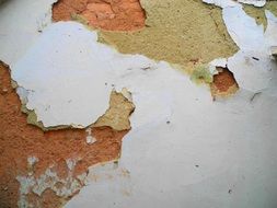 white clay on a brick wall of an old building