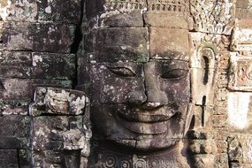 stone face on the wall in Bayon Temple