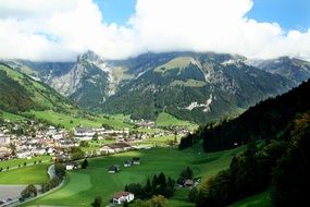 village at the foot of the mountains