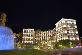fountain in front of the hotel in monte carlo at night
