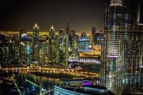 cityscape of Dubai with the colorful lights at night