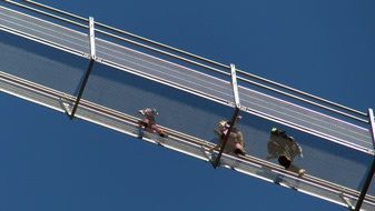 people on a pedestrian suspension bridge