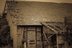 broken roof of an old house in monochrome