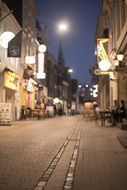 lighting street lamps at night