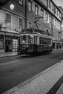 tram on the streets of lisbon in black and white background