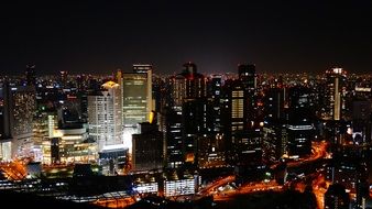 cityscape of glowing Osaka at night