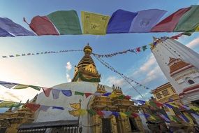 colorful flags over traditional asian architecture