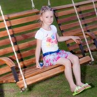 girl swinging on a swing