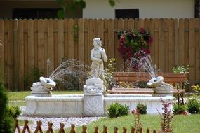 sculpture of Neptune in the garden fountain