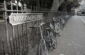 bicycles are parked on Magdalena Street in Oxford