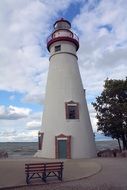 white lighthouse on the shore