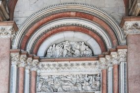 arched sculpture on the wall