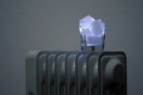 blue ice in a glass on the radiator