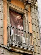 picture of a child on a poster on a balcony in Barcelona