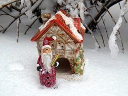 ceramic home and santa on the snow