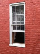 white window on the red wall