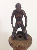 wooden sculpture of a man at the exhibition