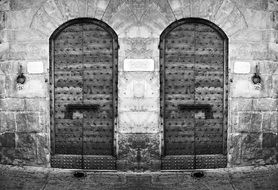black and white photo of the door to the building