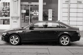 black audi on a city street