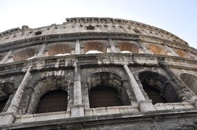 photo from below of colosseum facade