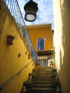 steps between yellow houses in provence