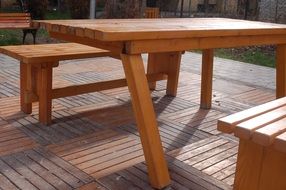 wooden table and benches for outdoor relaxation