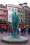 green statue of a angel in the main square