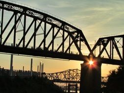 metal bridge at sunset