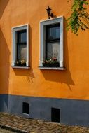 orange wall of a house with windows