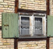 green window shutter of the farmhouse