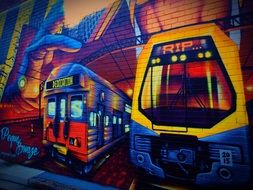 street graffiti on the wall in the form of trams