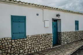 old building with blue door and windows