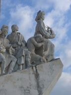 stone monument to sailors in the harbor