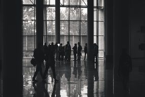 Black and white photo of the people in the hall