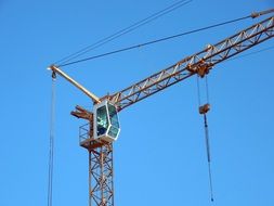 yellow construction crane on a site