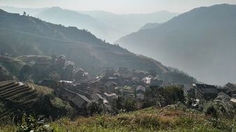 village in scenic mountains at foggy Sunrise, china, Guilin