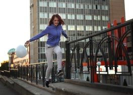 young happy girl with white balloon Walking Through The City, russia