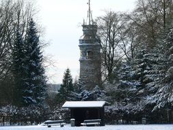 historical tower in winter forest in poland