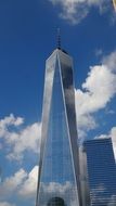 shopping center with a mirror facade under the blue sky in new york