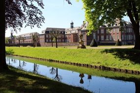 Nordkirchen Castle at park, view through moat, germany