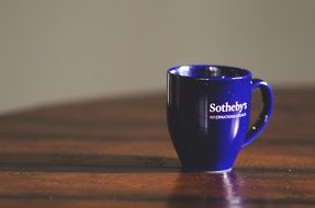 blue mug with sotheby's logo