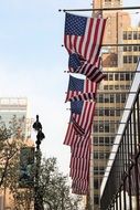 flags of America on the facade of a building, usa, manhattan, New York city