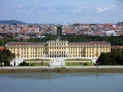 castle with green park near the river in Vienna